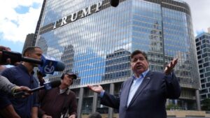 Trump targets Chicago and New York as Hegseth orders weapons for DC troops – The Guardian